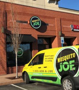 Yellow and black Mosquito Joe van parked outsided of Southwest Nashville office